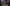 Spooky Room Stream Overlay for Twitch with moody haunted gaming room, warm candlelight, floating embers and cinematic Halloween-inspired aesthetic