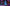 Neon Christmas Stream Overlay for Twitch with cozy neon gaming room, purple and pink lighting, glowing pumpkins and playful spooky-inspired aesthetic